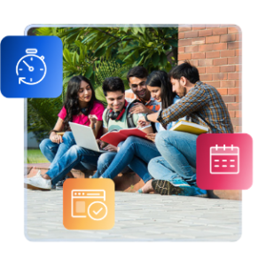A group of international students sit next to a brick building, looking at a laptop together.