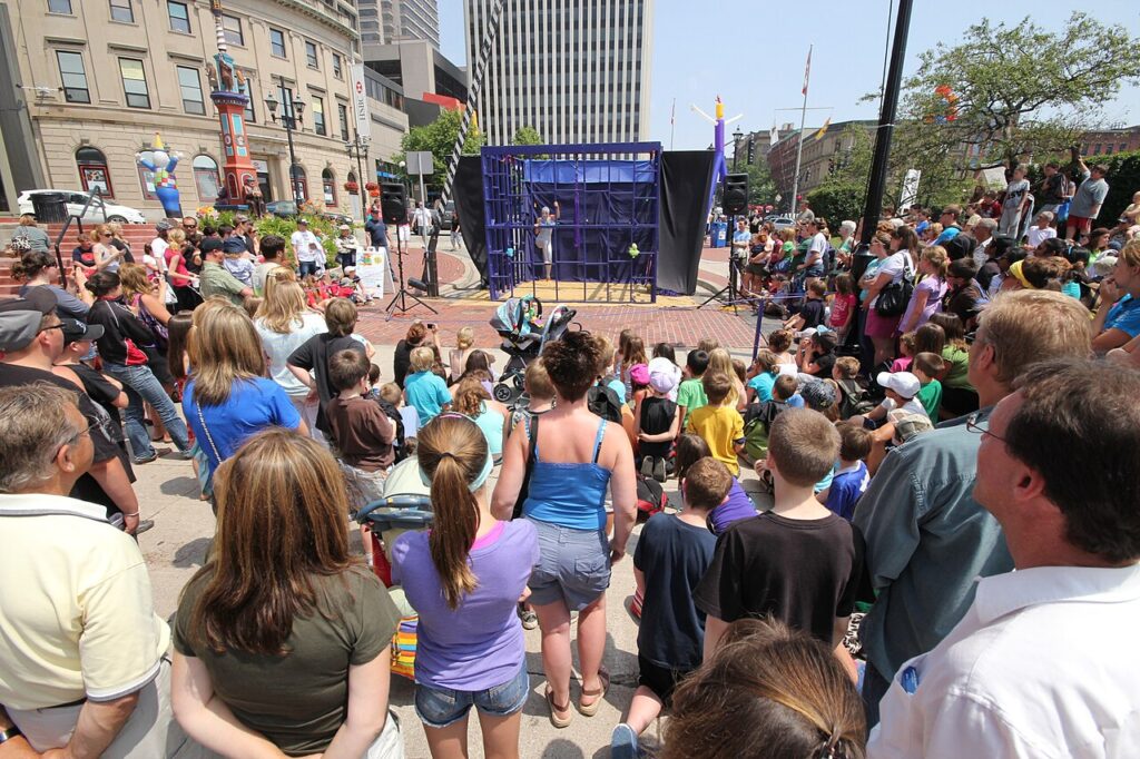 Locals gather to watch street performers at the Buskers Festival in Saint John, NB